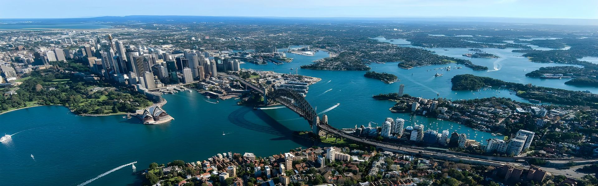 An Aerial View of a Large Body of Water With a City in the Background — Accurate Fitout Solutions In Wetherill Park, NSW