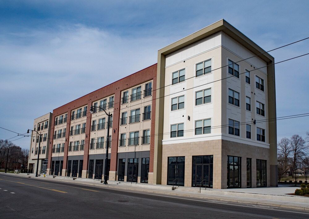 A Large Building With a Lot of Windows is on the Side of the Road — Accurate Fitout Solutions In Sydney, NSW