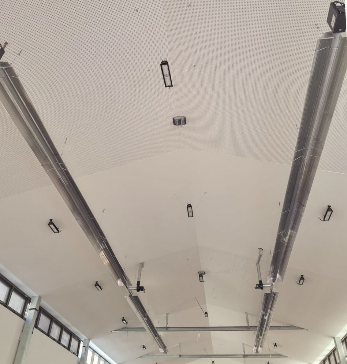 A Ceiling With a Lot of Lights Hanging From It — Accurate Fitout Solutions In Mascot, NSW