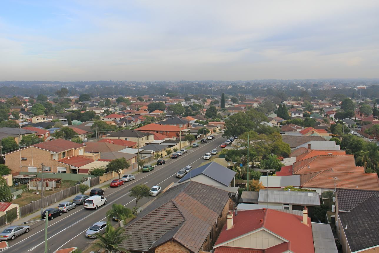 An Aerial View of a Residential Area With a Street and Houses — Accurate Fitout Solutions In Auburn, NSW