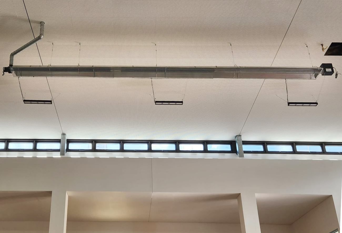 The Ceiling of a Building With a Drain Pipe Hanging From It — Accurate Fitout Solutions In Prestons, NSW