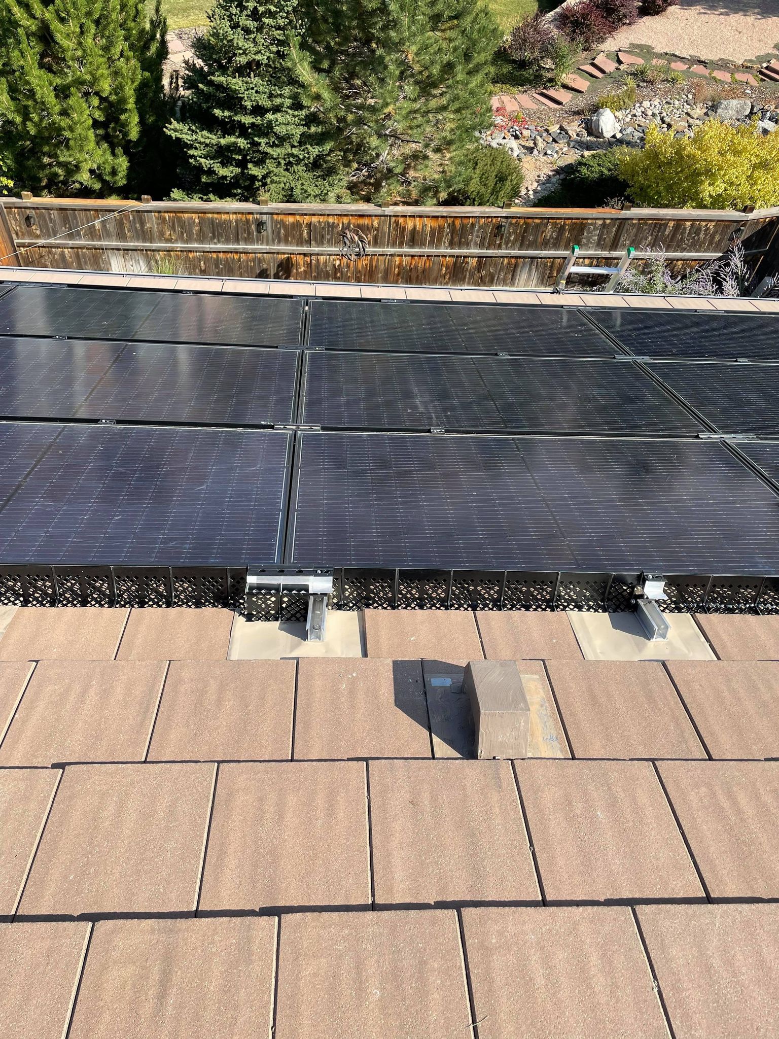 A roof with a lot of solar panels on it.