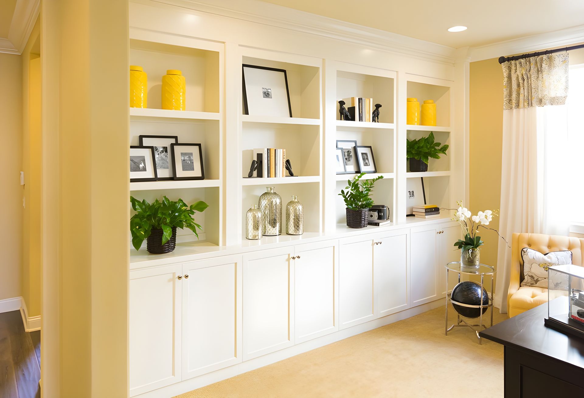 A yellow waiting area with custom cabinets — The Right Kitchen Company in Dapto, NSW