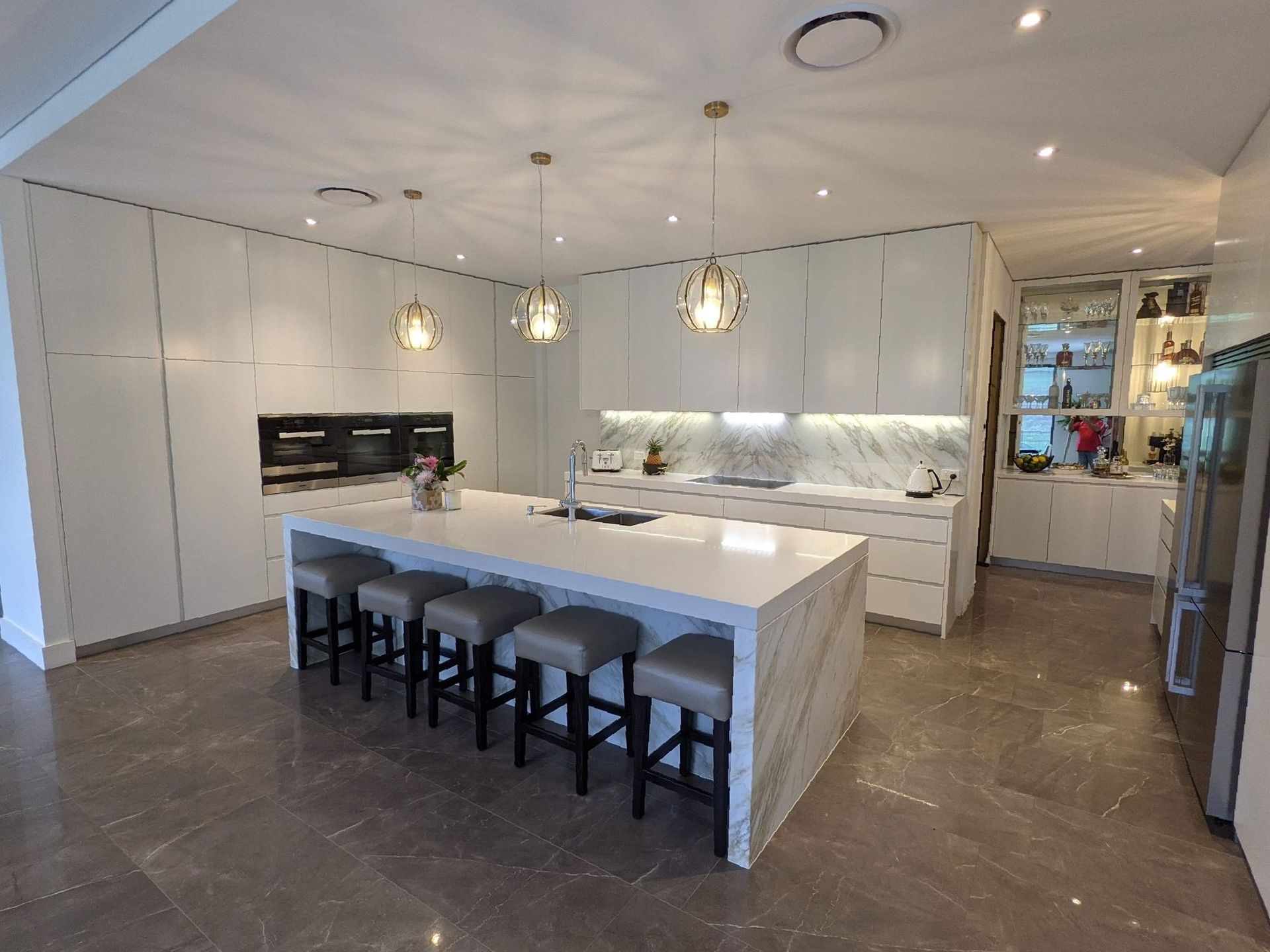 A Kitchen With White Cabinets And Stainless Steel Appliances — The Right Kitchen Company In Berkeley, NSW