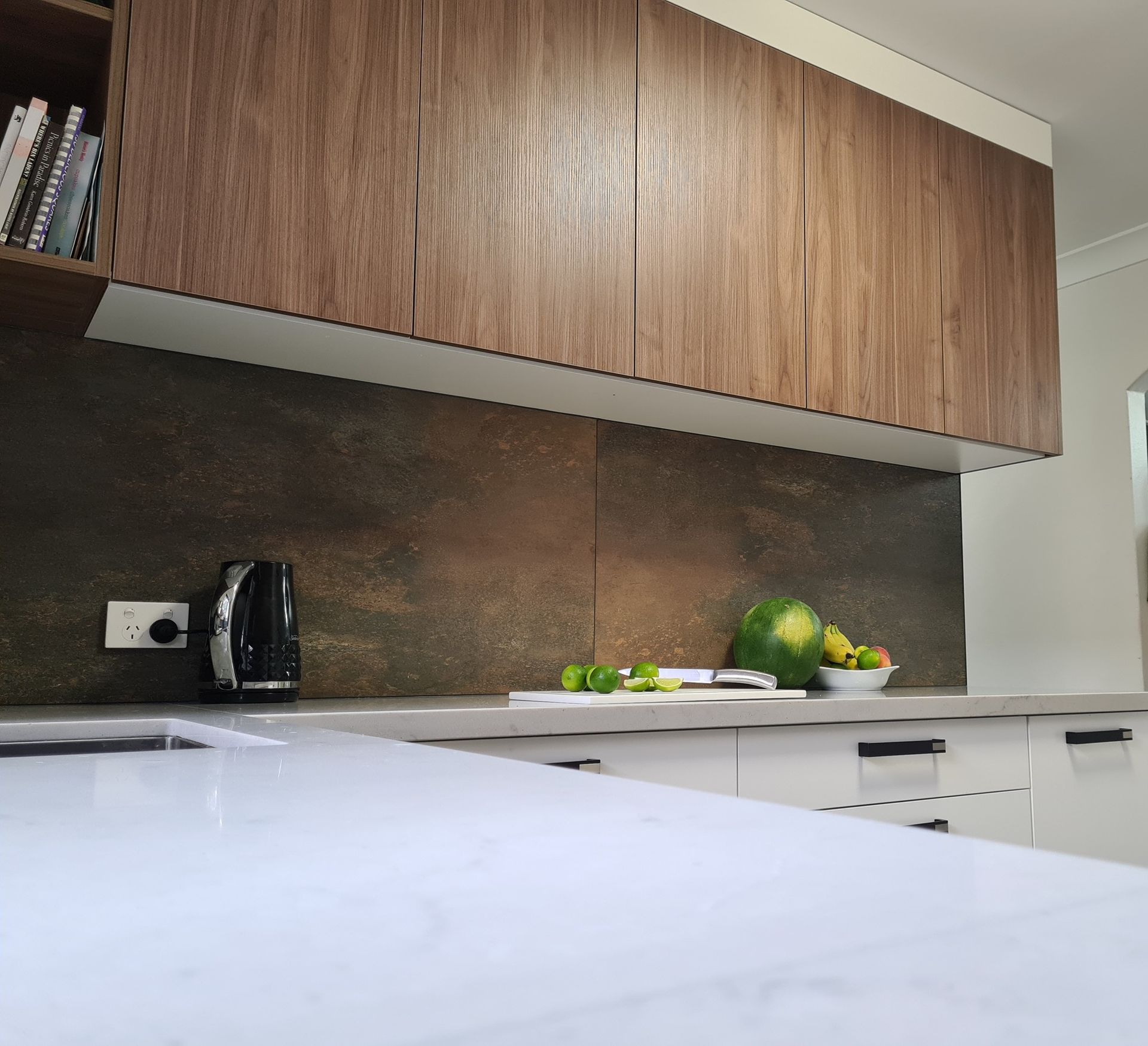 a kitchen bench with wooden cabinets above it — The Right Kitchen Company In Berkeley, NSW