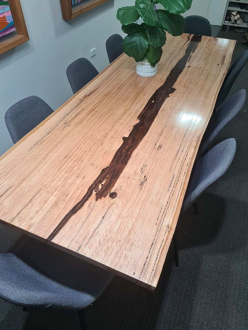 A Wooden Table With A Plant On Top Of It — The Right Kitchen Company In Berkley, NSW