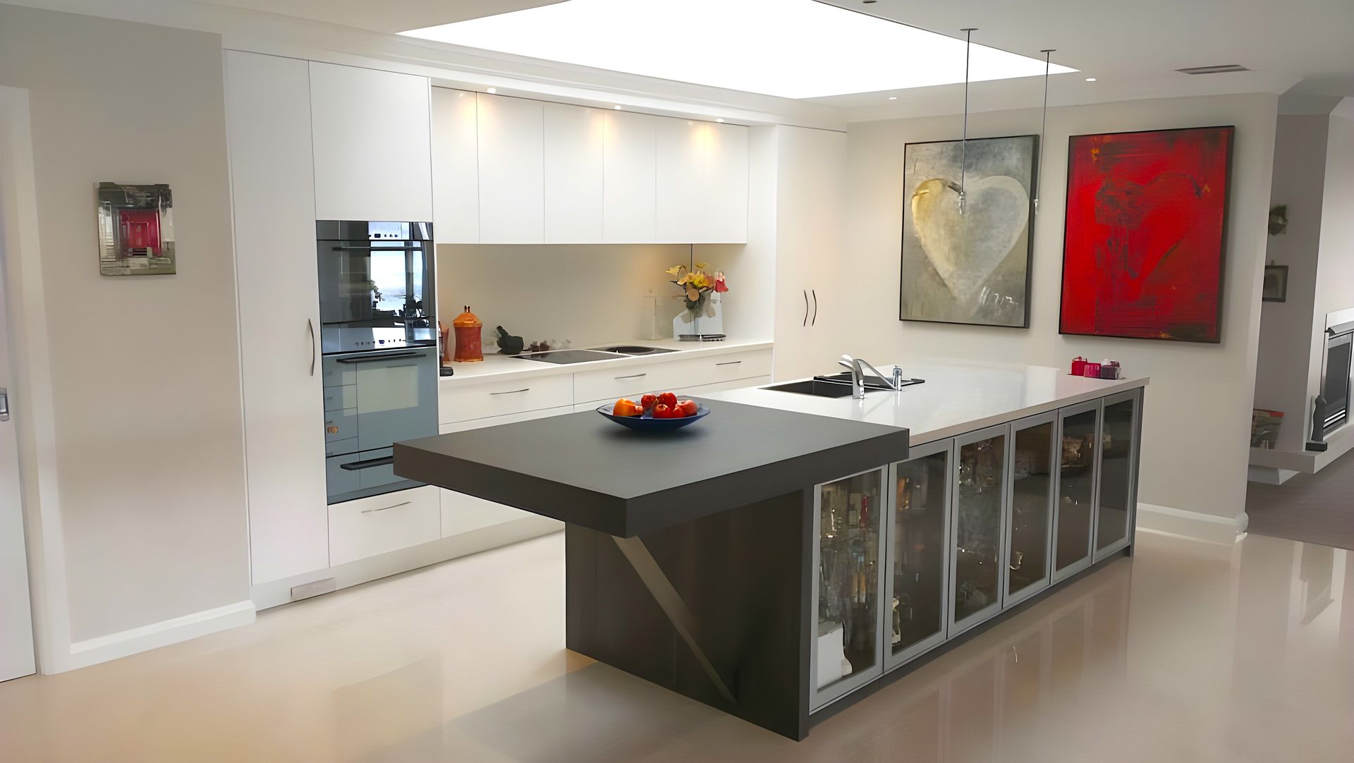 A Kitchen With A Large Island And A Bowl Of Fruit On It — The Right Kitchen Company In Berkeley, NSW