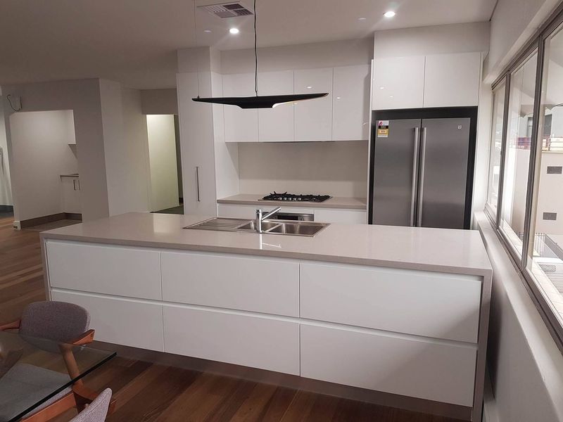 Modern Kitchen With White Cabinets — The Right Kitchen Company In Berkeley, NSW Modern Kitchen With White Cabinets — The Right Kitchen Company In Berkeley, NSW