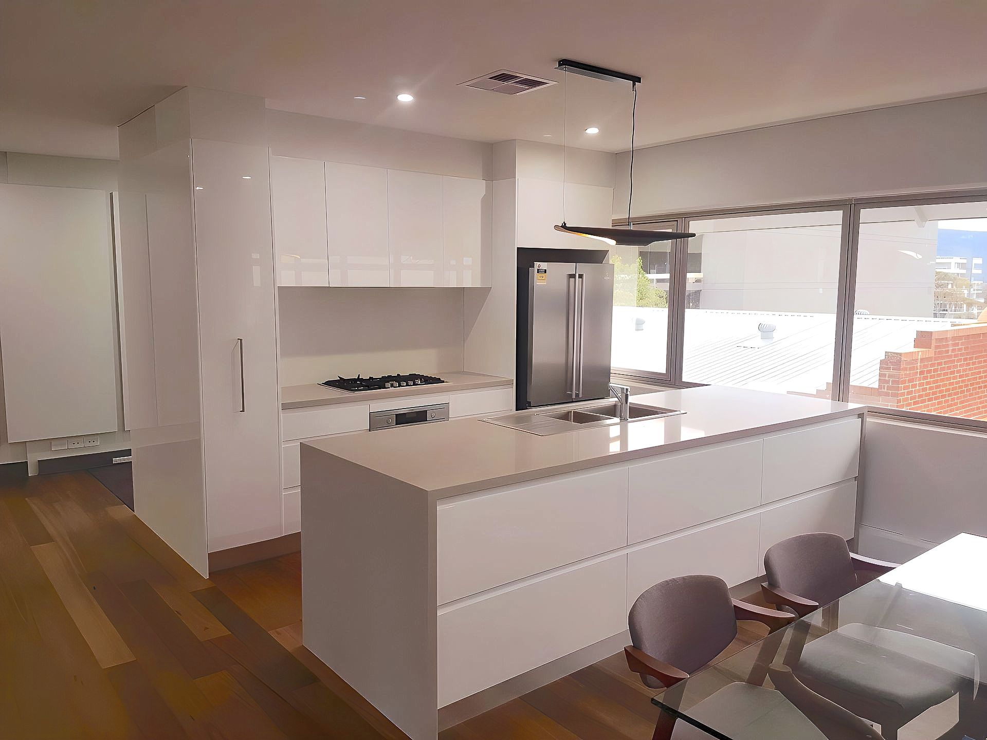 A Bathroom With A Bathtub , Sinks , And A Large Mirror — The Right Kitchen Company in Kiama, NSW