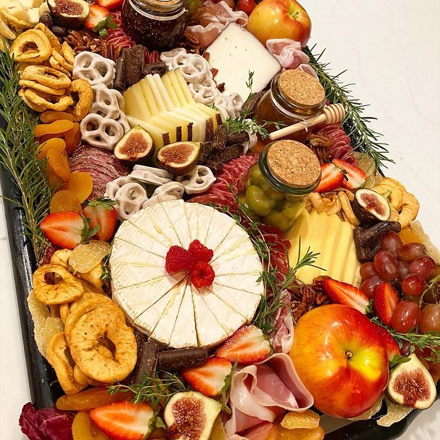 A large tray filled with lots of different types of food.