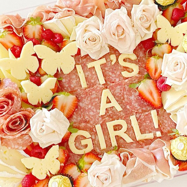 A sign that says it 's a girl on it