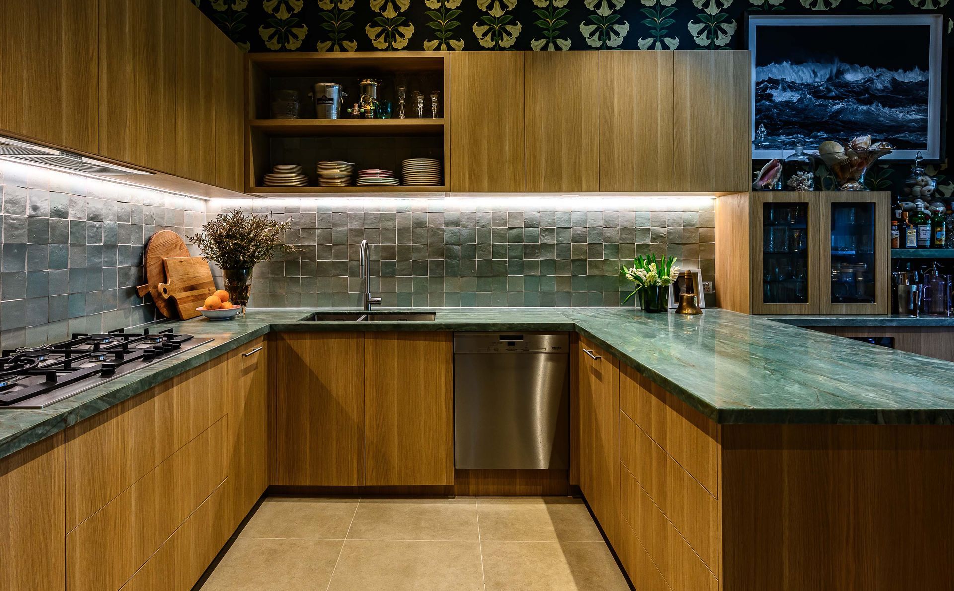 A kitchen with wooden cabinets and a green counter top.