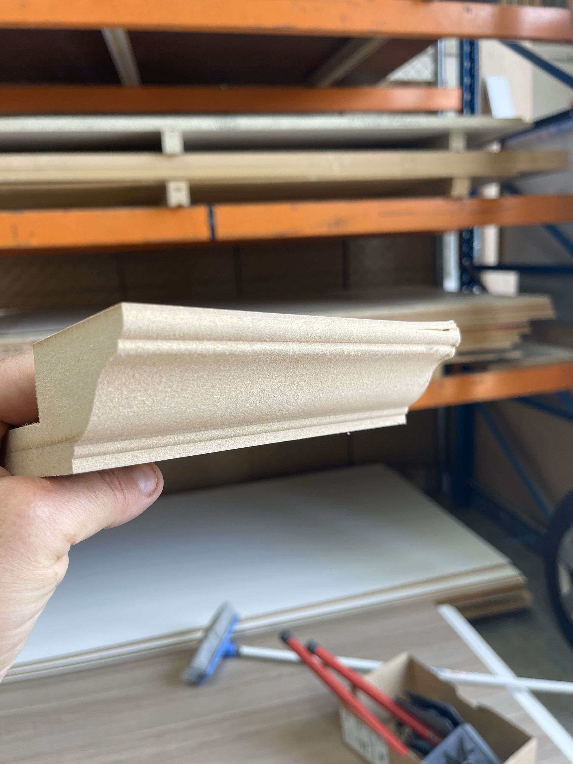 A plane is sitting on a piece of wood on a workbench