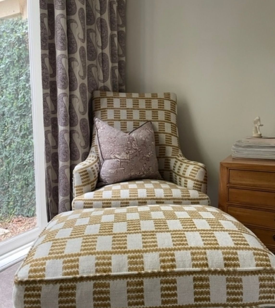 A close up of a chair 's leg on a rug.