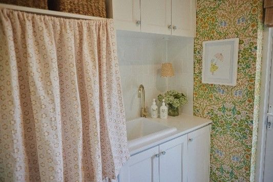 A bathroom with a toilet, sink and shower.