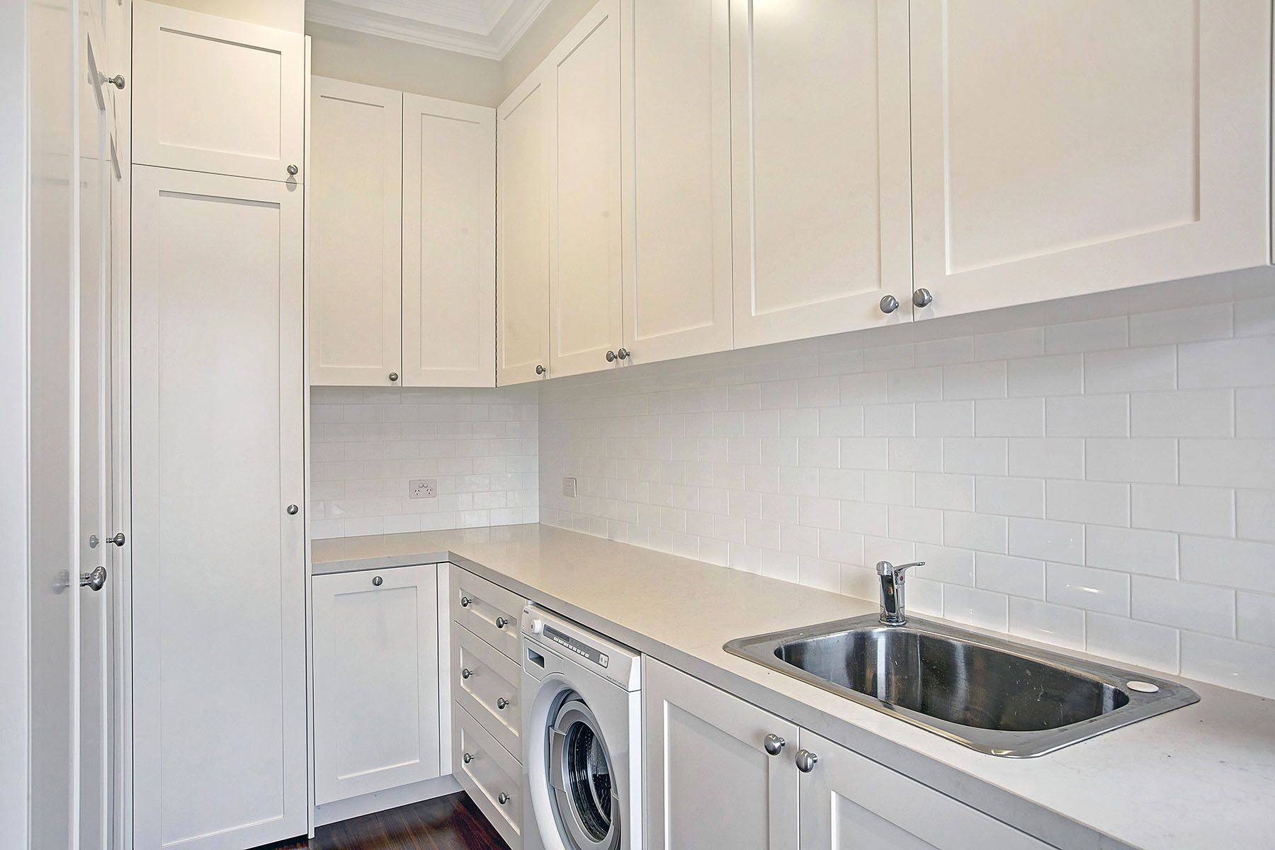 A bathroom with a bathtub, toilet, sink and mirror.