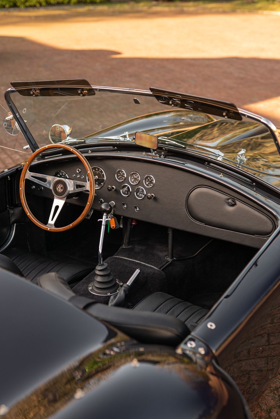 AC Cobra MKiv Mk IV mk4 4 retrim restoration respray repaint paint refurbish restore resto leather carpet black vaumol grained crushed how to trim redline engineering d:class dclass auto automotive golden hour seats steering wheel dashboard