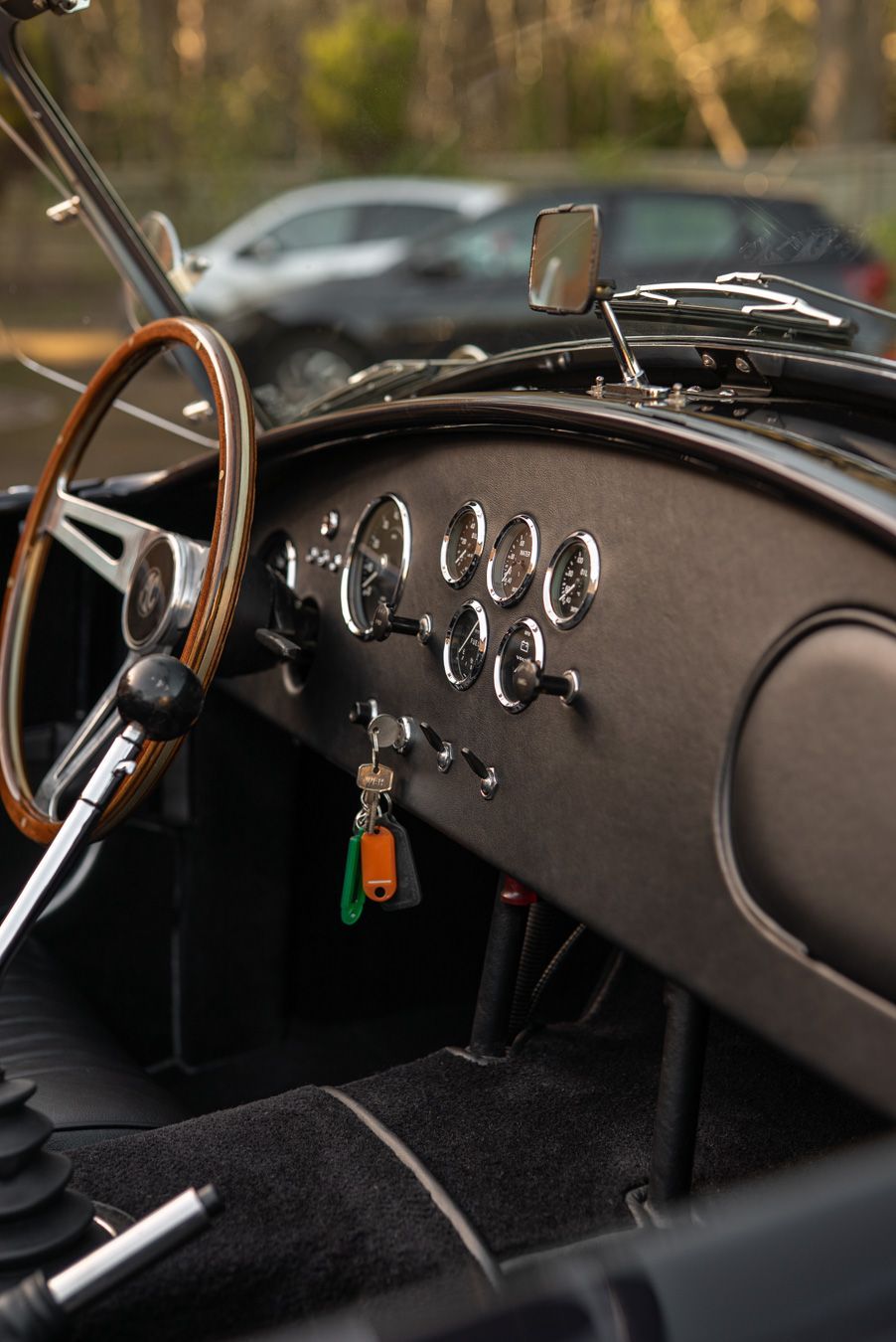 AC Cobra MKiv Mk IV mk4 4 retrim restoration respray repaint paint refurbish restore resto leather carpet black vaumol grained crushed how to trim redline engineering d:class dclass auto automotive golden hour seats steering wheel dashboard