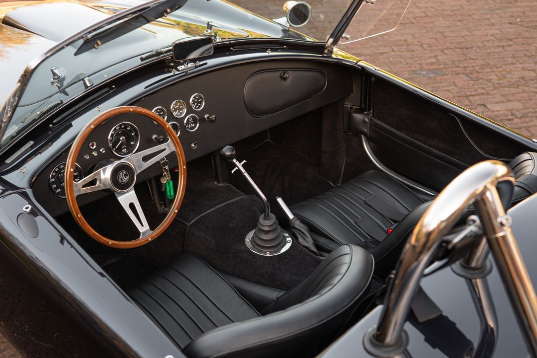 AC Cobra MKiv Mk IV mk4 4 retrim restoration respray repaint paint refurbish restore resto leather carpet black vaumol grained crushed how to trim redline engineering d:class dclass auto automotive golden hour seats steering wheel dashboard