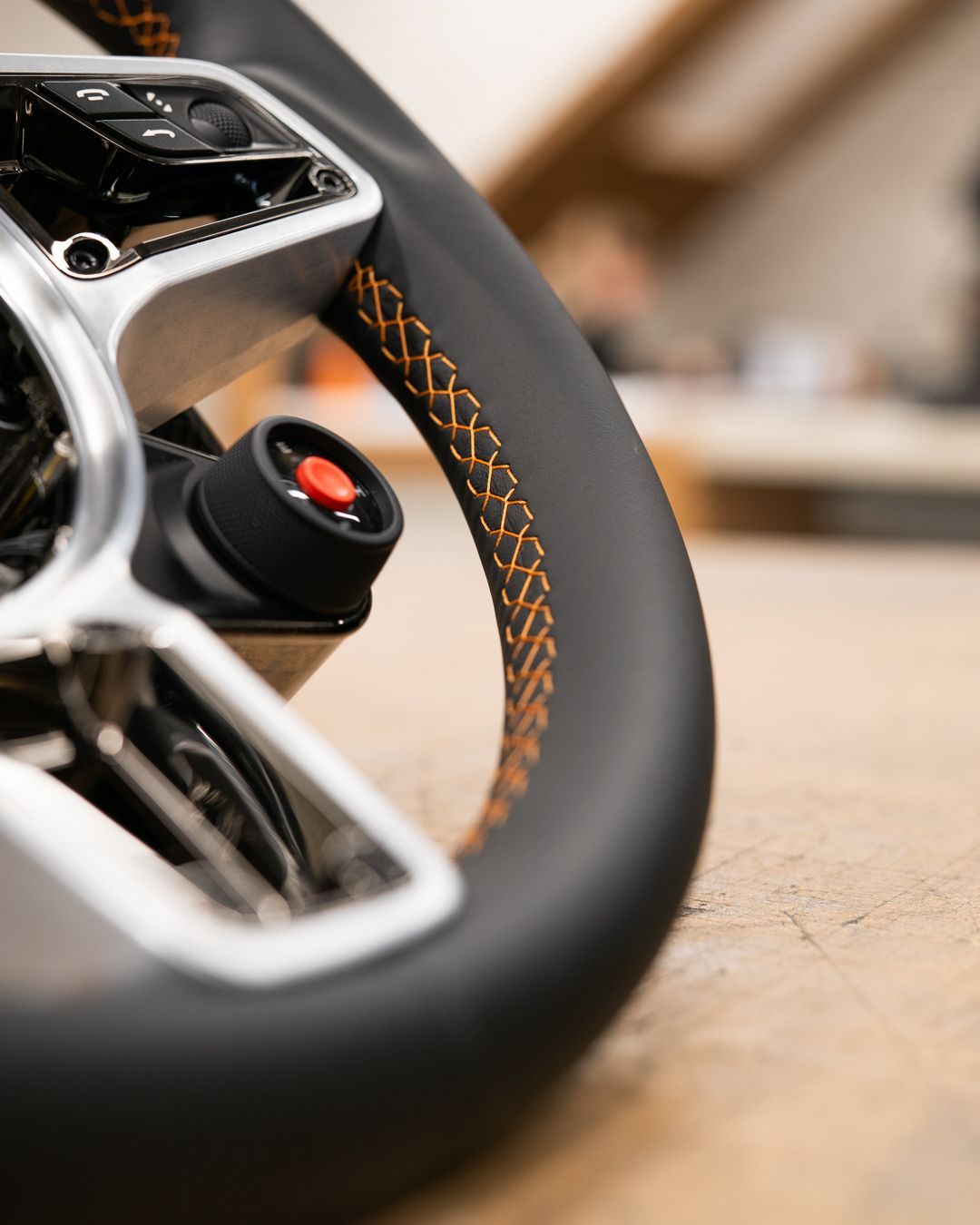 porsche 918 spyder steering wheel retrim black nappa leather orange racing band d:class dclass auto automotive near me interior stitch stitching oem 