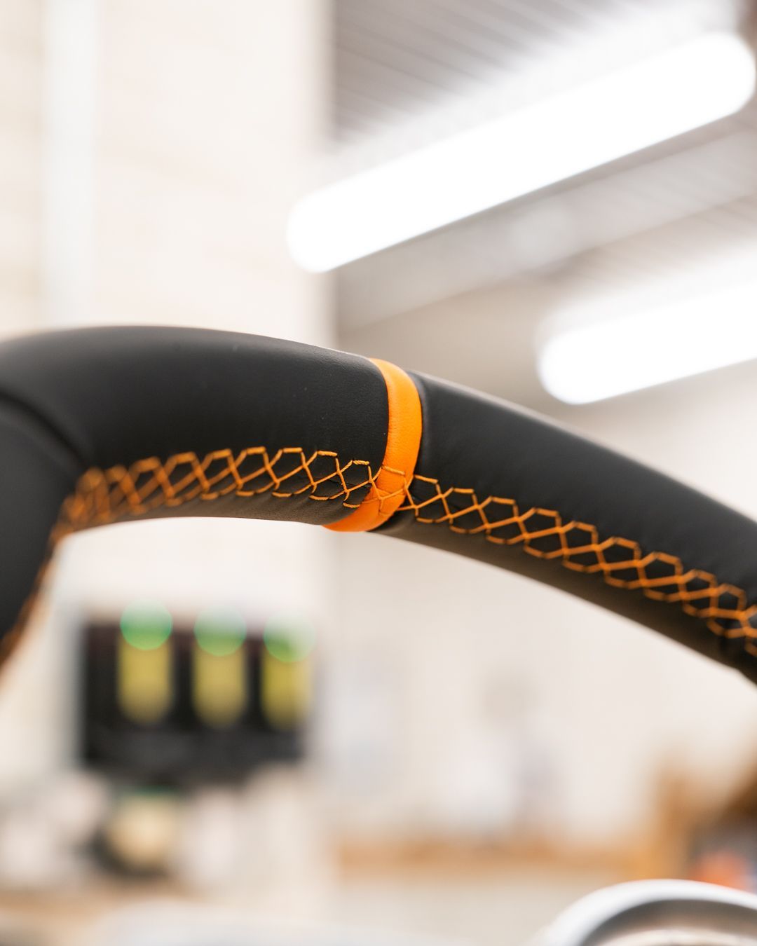 porsche 918 spyder steering wheel retrim black nappa leather orange racing band d:class dclass auto automotive near me interior stitch stitching oem 