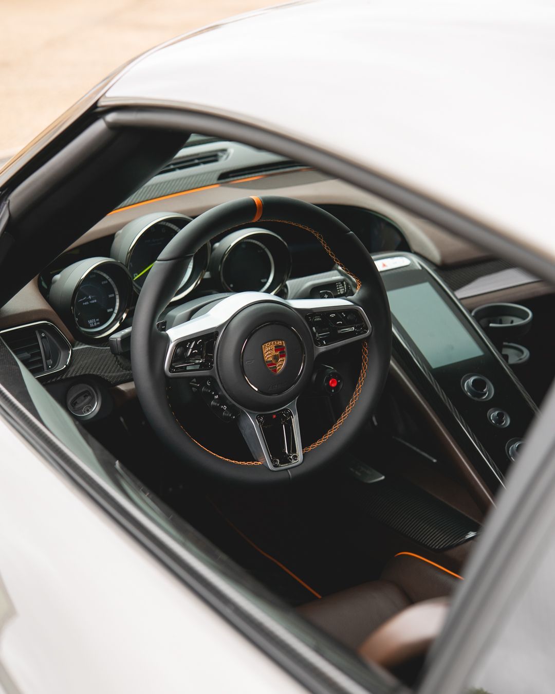 porsche 918 spyder steering wheel retrim black nappa leather orange racing band d:class dclass auto automotive near me interior stitch stitching oem 