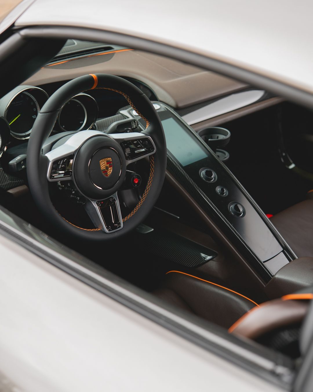 porsche 918 spyder steering wheel retrim black nappa leather orange racing band d:class dclass auto automotive near me interior stitch stitching oem 