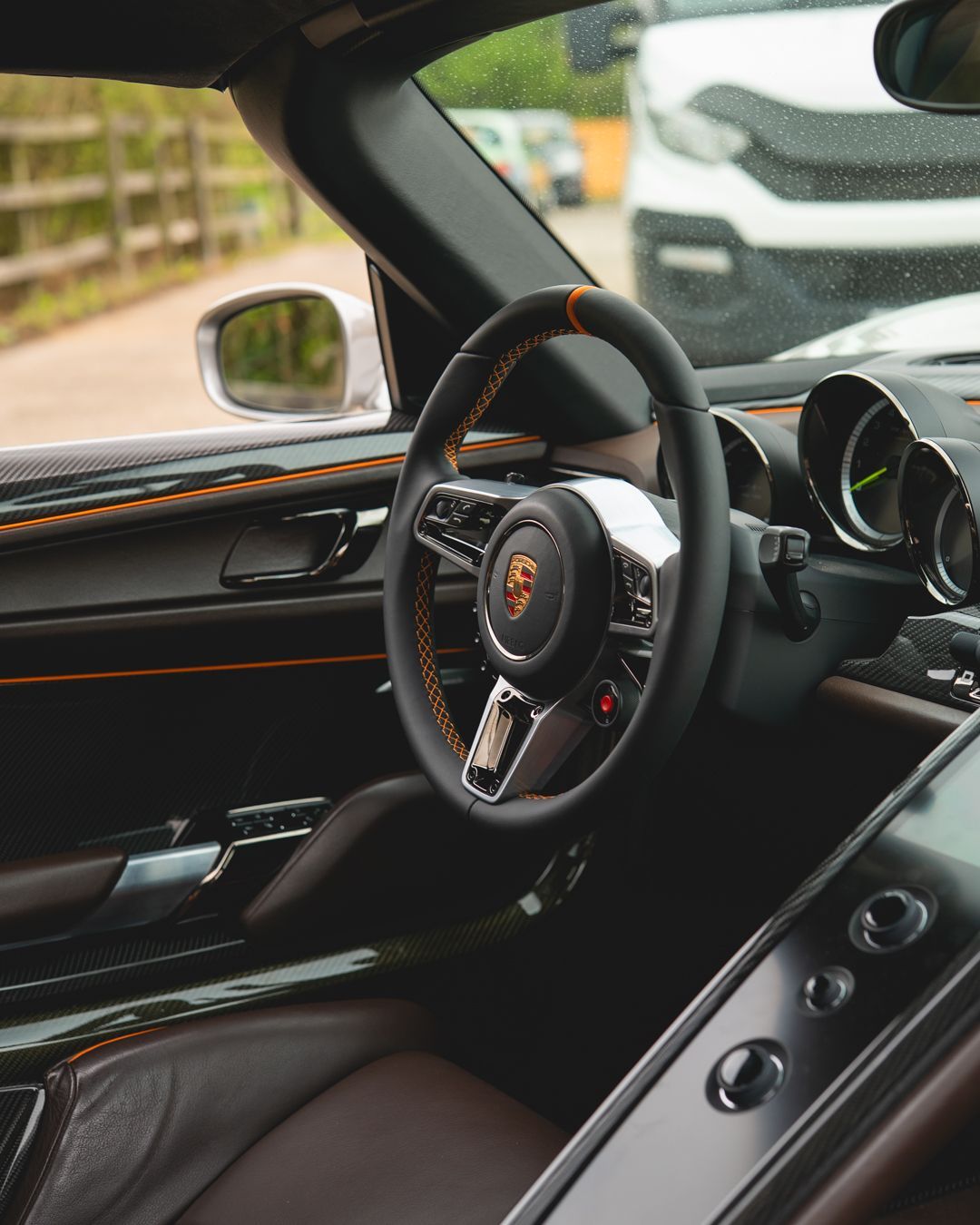 porsche 918 spyder steering wheel retrim black nappa leather orange racing band d:class dclass auto automotive near me interior stitch stitching oem 