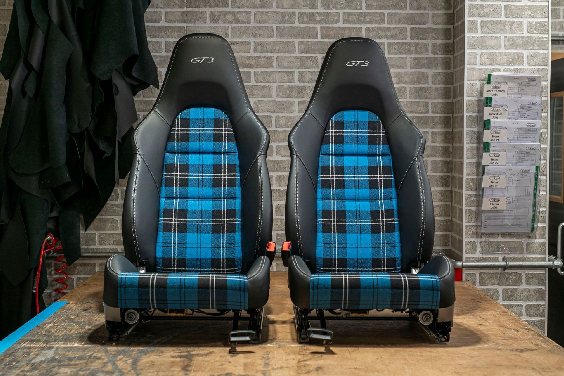 a pair of porsche gt3 sport comfort seats retrimmed in blue tartan cloth material retrim upholstery