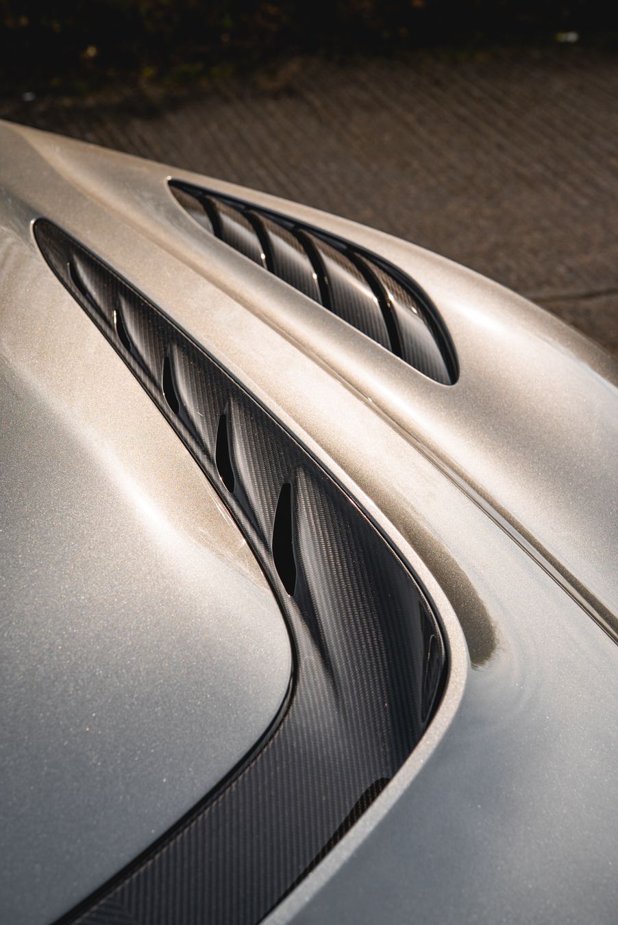 aston martin DBS 770 ultimate grey metallic carbon fibre vent bonnet portrait vertical angle view dclass d:class