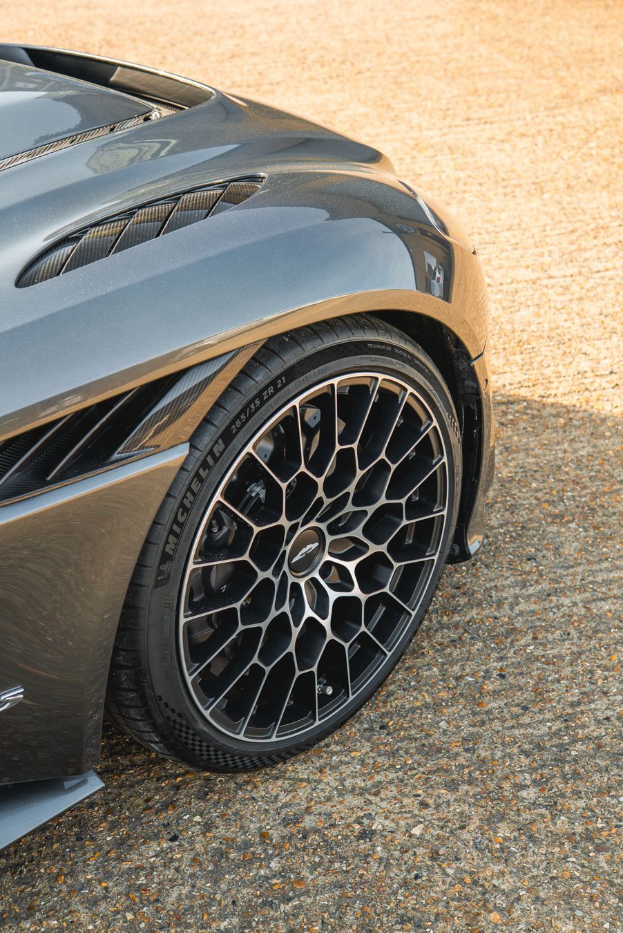 aston martin DBS 770 ultimate grey metallic wheel top down quarter angle view portrait vertical