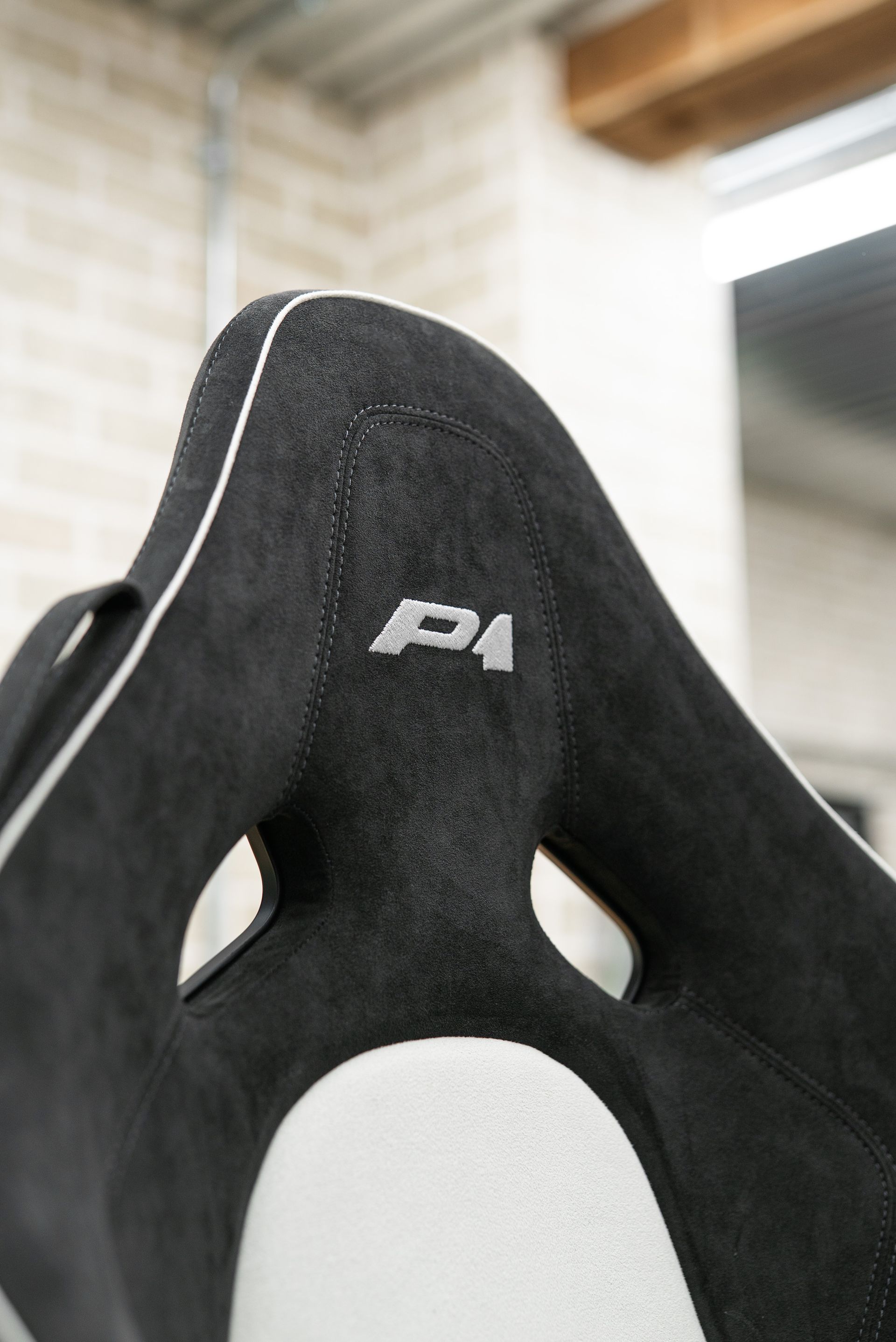 mclaren p1 seats retrim retrimmed trim trimmed alcantara logo embroidery black white micro piping micro-piping interior dclass d:class near me vehicle embroidery embroidered