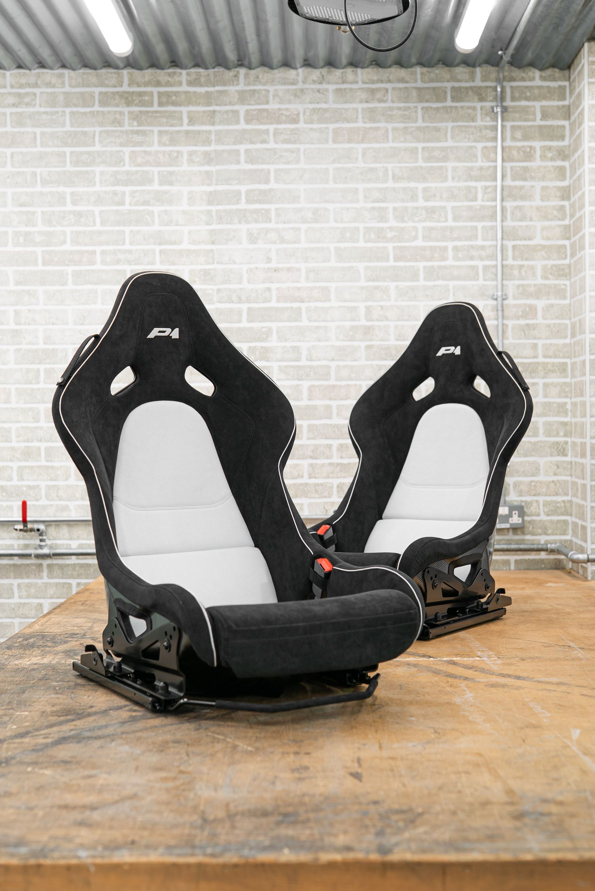mclaren p1 seats retrim retrimmed trim trimmed alcantara logo embroidery black white micro piping micro-piping interior dclass d:class near me vehicle embroidery embroidered