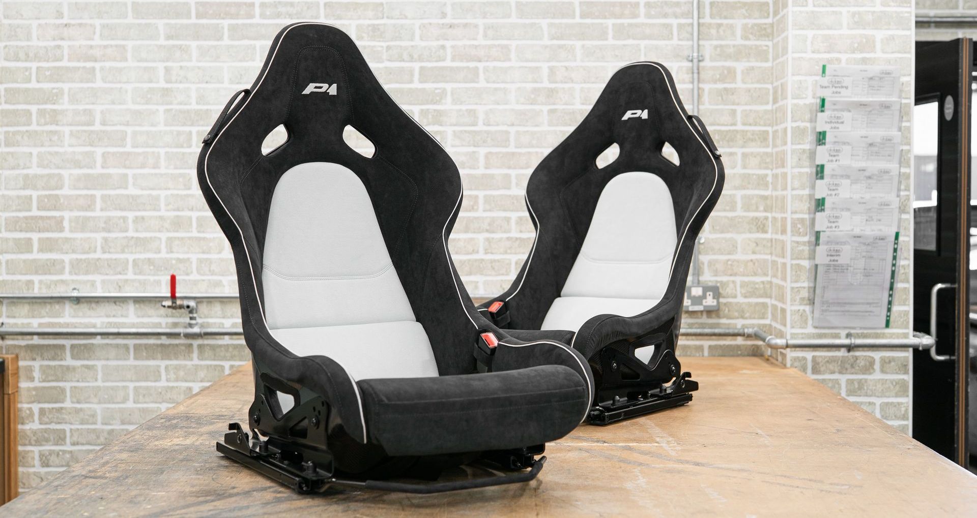 mclaren p1 seats retrim retrimmed trim trimmed alcantara logo embroidery black white micro piping micro-piping interior dclass d:class near me vehicle embroidery logo embroidered
