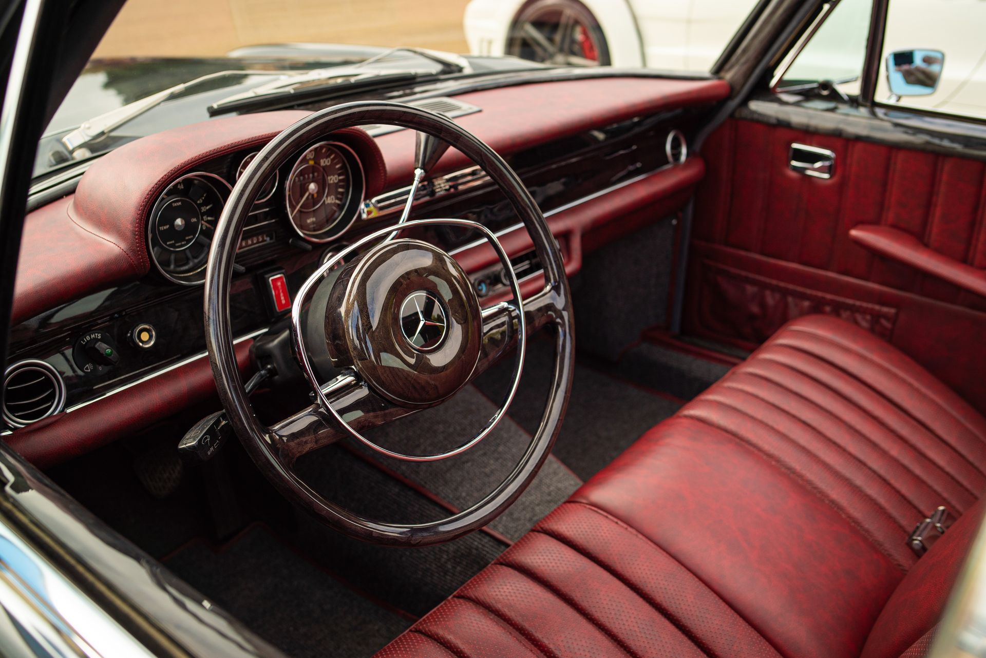 mercedes-benz W109 custom interior retrim leather distressed red d:class automotive modified grey silver bench seat seats dougie