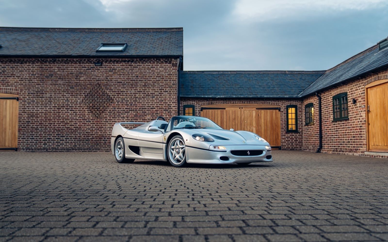 silver ferrari F50 convertible interior retrim yellow DK Engineering pebble beach monterey car week