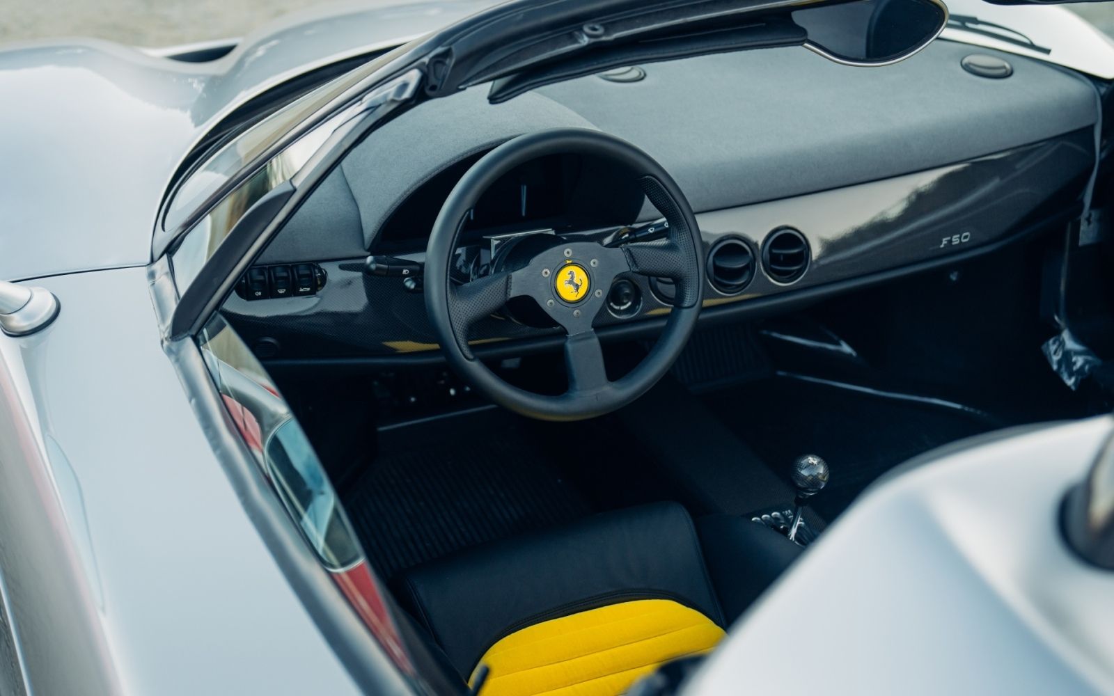 Silver Ferrari F50 DK Engineering convertible spyder monterey car week pebble beach for sale sold restoration