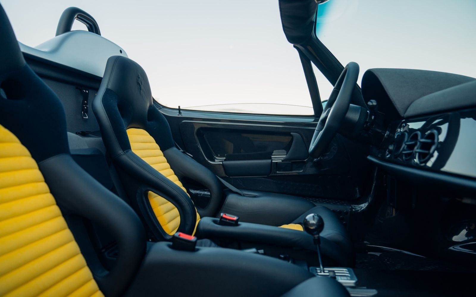 Silver Ferrari F50 DK Engineering convertible spyder monterey car week pebble beach for sale sold restoration