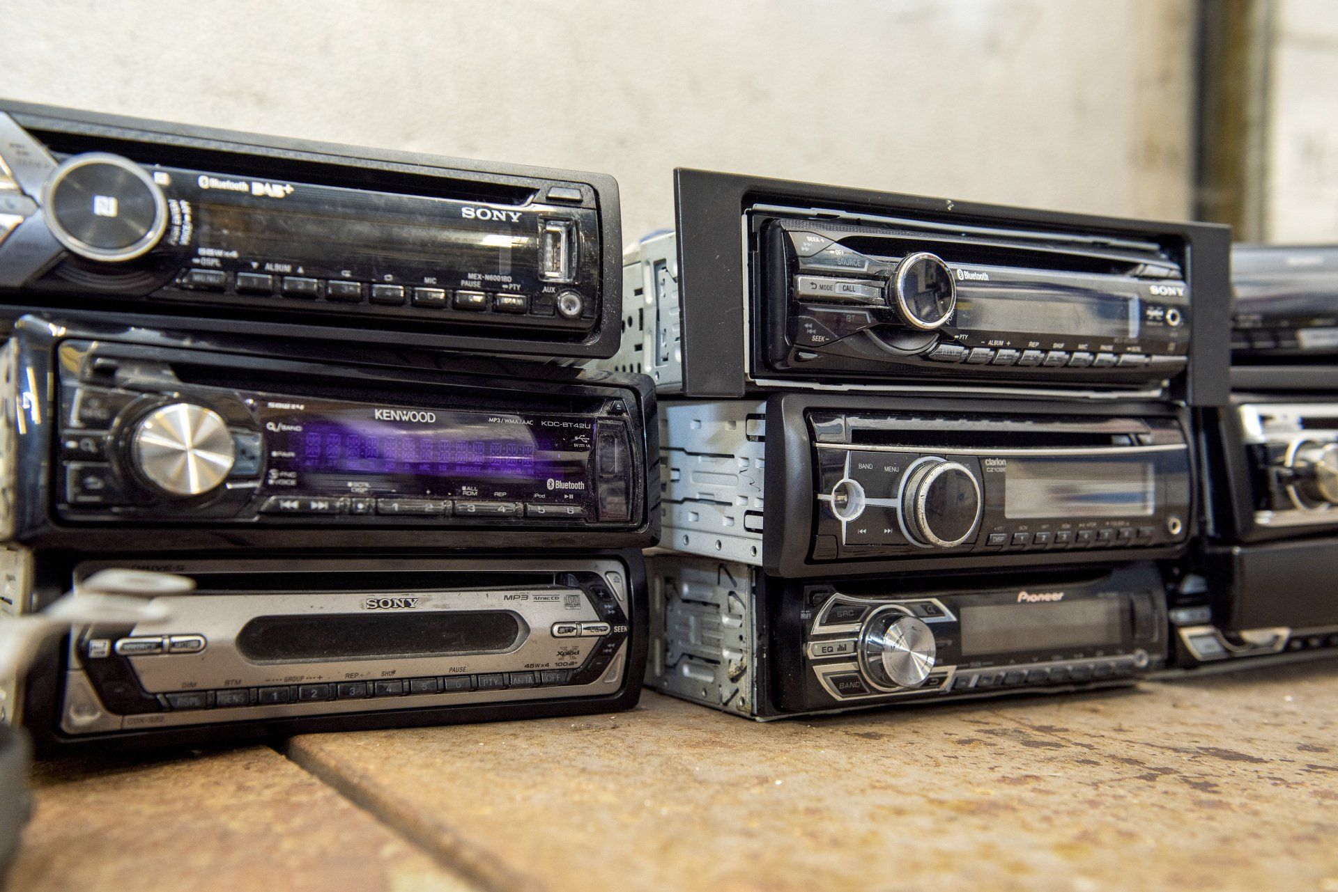 Pile of old scrapped car CD player, Kenwood, Sony