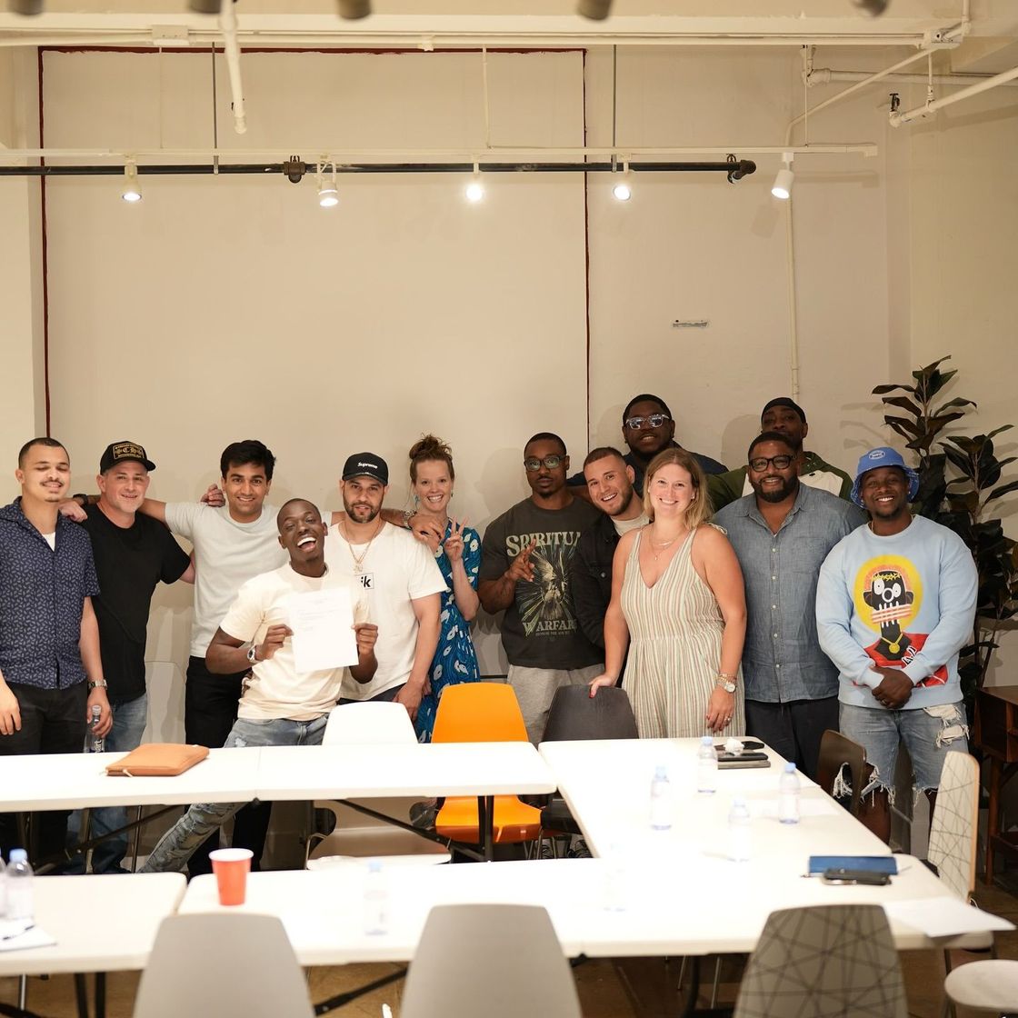 A group of people are posing for a picture in a room