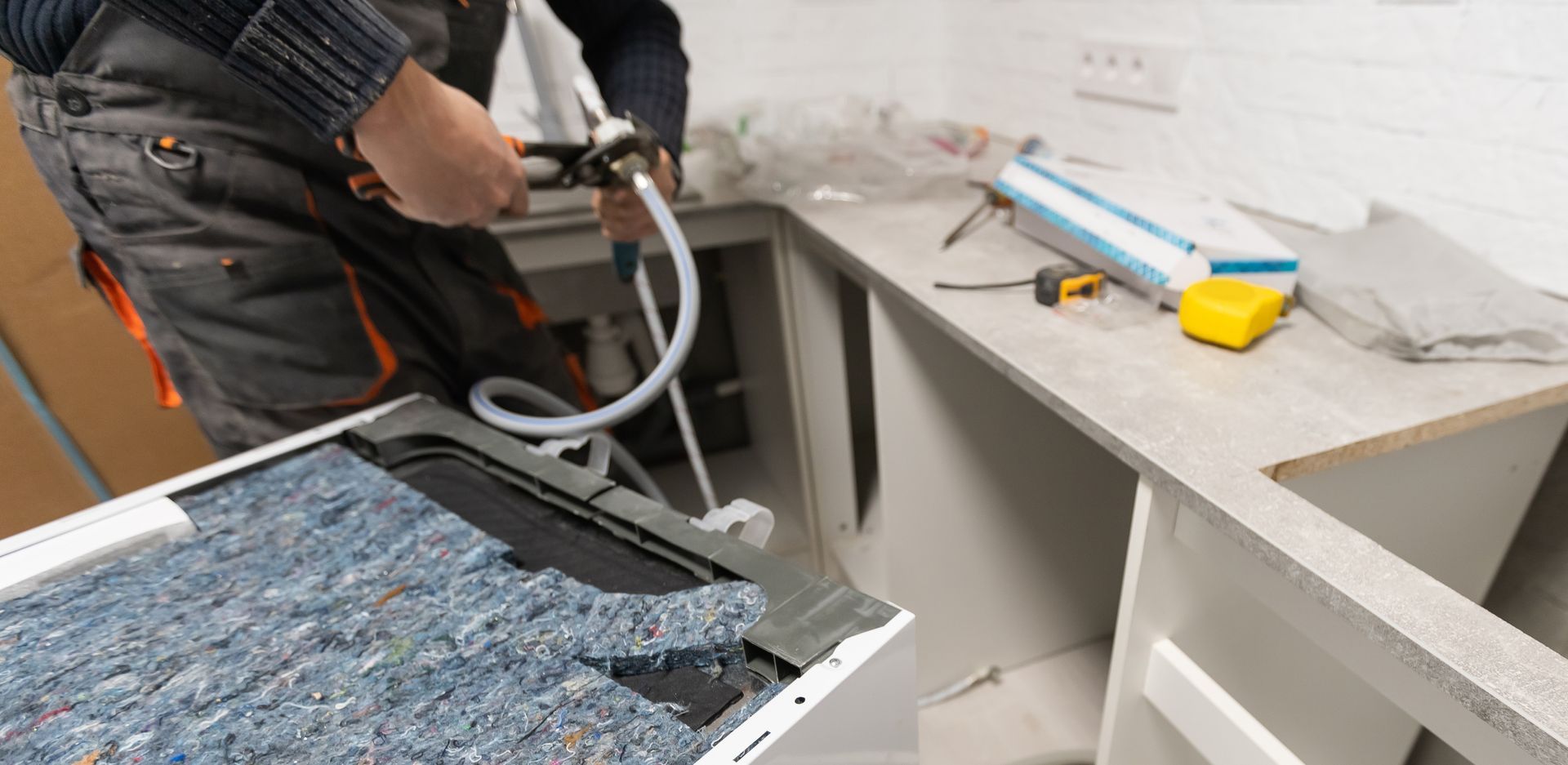 An image of a kitchen countertop installation during renovation.