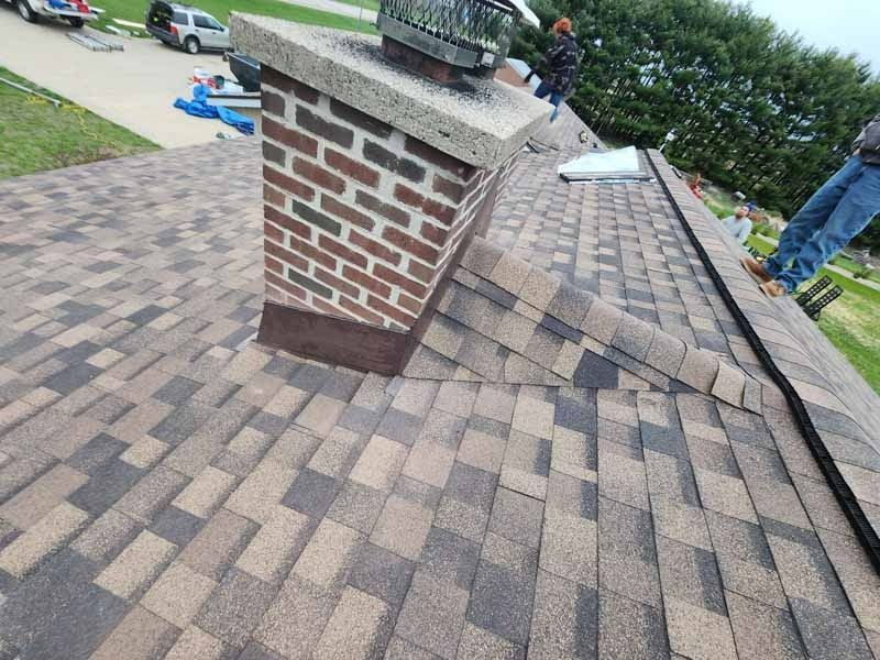A roof with a chimney on top of it.