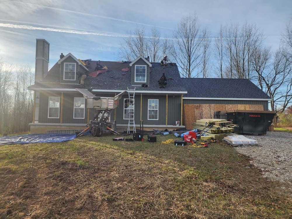 A house is being remodeled with a new roof.