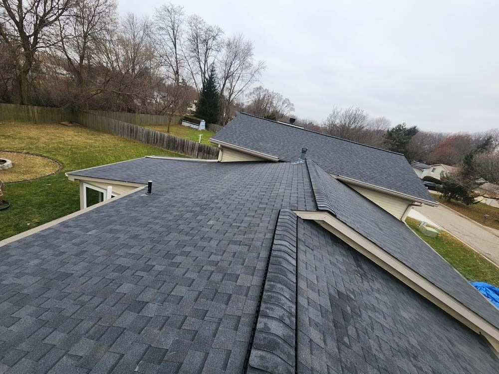 The roof of a house with a lot of shingles on it.