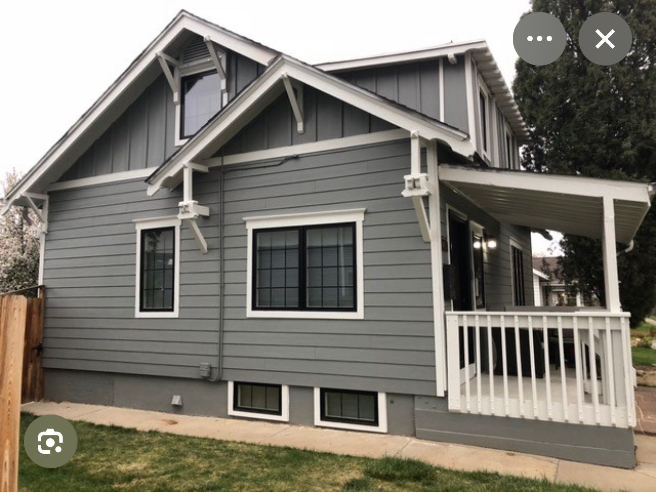 A house with a window and scaffolding on the side of it.