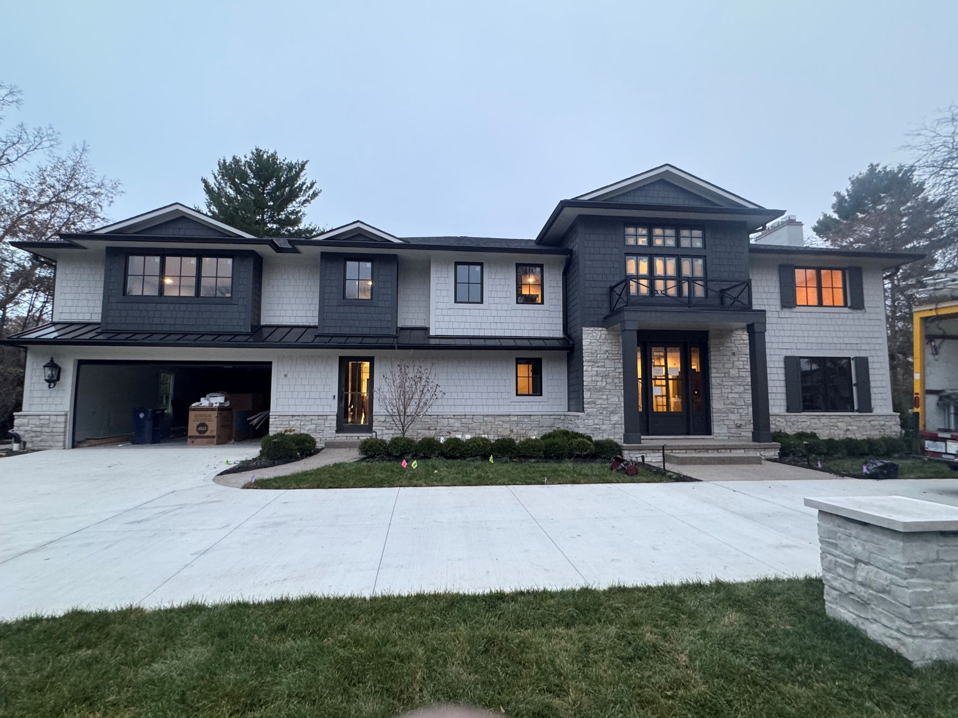 A gutter on the side of a building with a tiled roof.