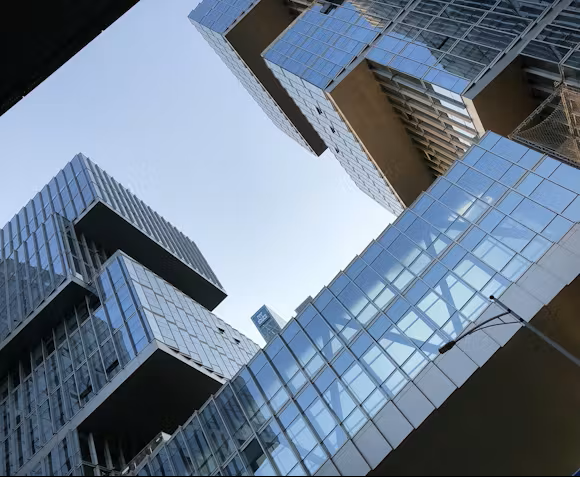 Blue glowing network overlaying city skyline at night.