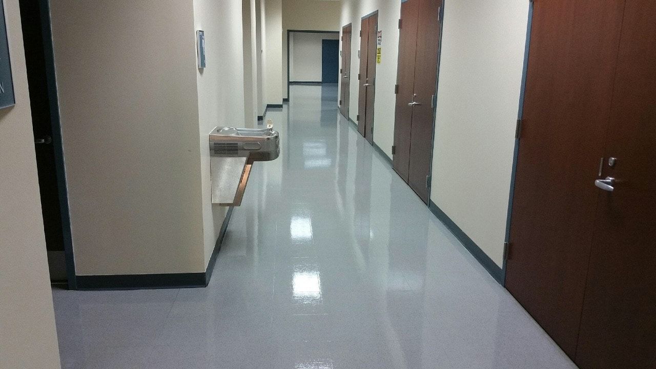 A long hallway with a water fountain in the middle