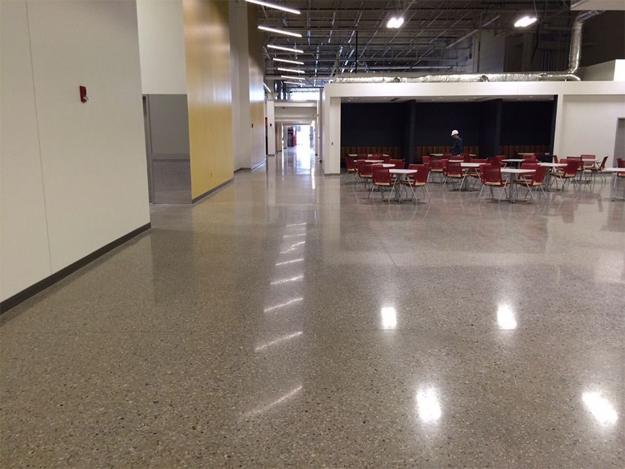 A hallway with tables and chairs in it