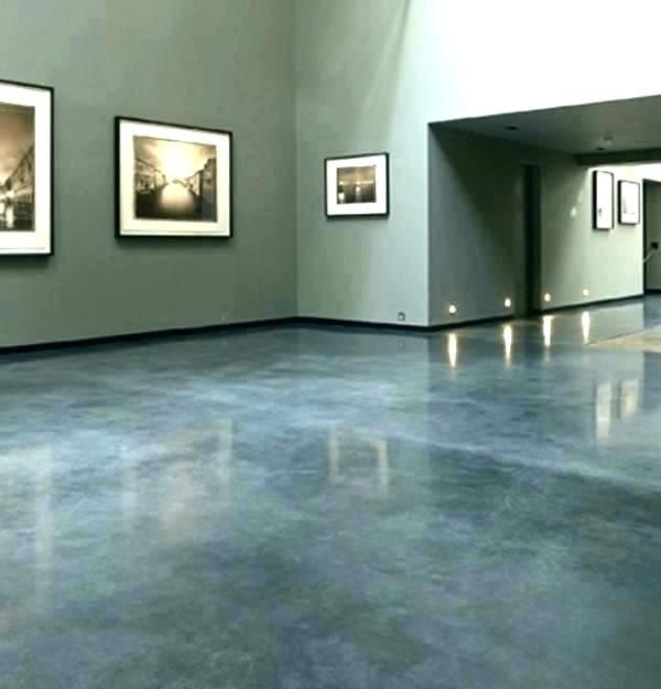 A room with pictures on the wall and a shiny floor